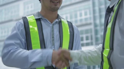 Business concept of 4k Resolution. Engineers are congratulating each other on Stock Footage 153797663