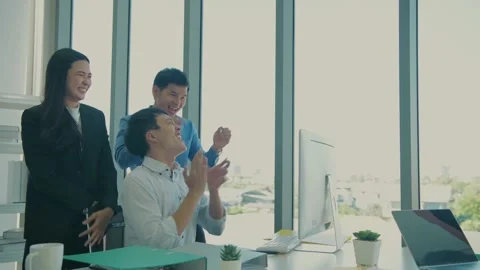 Business concept of 4k Resolution. The team is delighted with the success of  Stock Footage 144890680