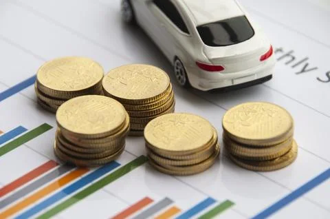 Business concept. Analysis of data through bar chart with gold coins and to.. Stock Photos