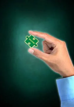  Business concept finding solution Businessman showing the piece of puzzle... Stock Photos
