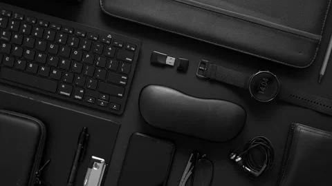 Business concept. Flat lay composition with various black gadgets on dark black Stock Footage 132971341