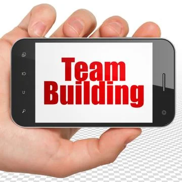 Business concept: Hand Holding Smartphone with Team Building on display Ilustración de archivo