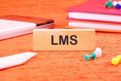 Business concept. Learning Management System LMS word on wooden blocks in fro Stock Photos