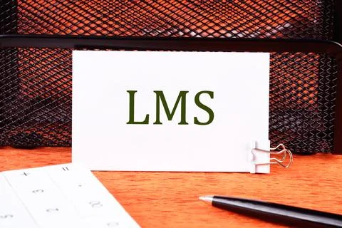 Business concept. Learning Management System LMS word on a white business car Stock Photos
