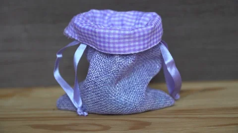 Business concept - man hand throw euro coins into little purple bag Video stock 92847085