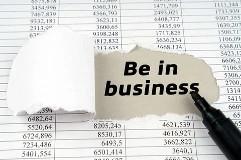 Business concept. In the middle of the document with financial statements, th Stock Photos