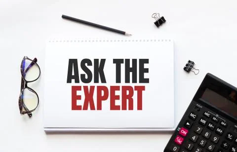 Business concept. Notebook with text ASK THE EXPERT sheet of white paper for  Stock Photos