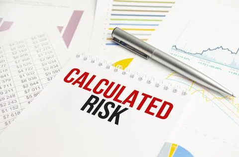 Business concept. Notebook with text Calculated risk sheet of white paper for Stock Photos