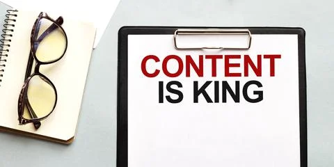 Business concept. Notebook with text coNTENT IS KING sheet of white paper for Stock Photos