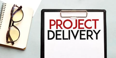Business concept. Notebook with text PROJECT DELIVERY sheet of white paper fo Foto stock