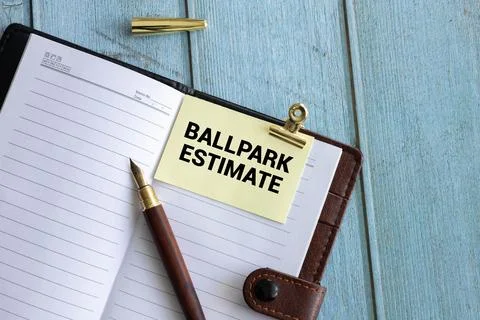 Business concept. open notepad with text on calendar - BALLPARK ESTIMATE Stock Photos