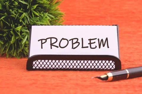 Business concept. PROBLEM text on a white business card and a stand Stock Photos