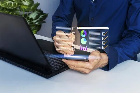 Business concept using mobile phone to check data and analyze work quality .. Stock Photos