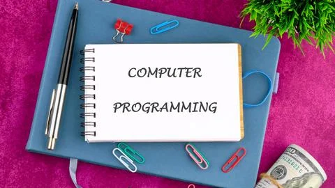 Business concept. Words COMPUTER PROGRAMMING in a mini notebook on a business Stock Photos