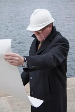Business construction man engineer architect with blueprint on the work site Stock Photos