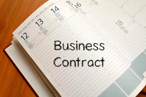 Business contract write on notebook Stock Photos