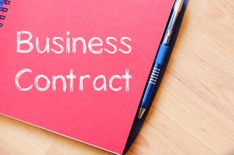 Business contract write on notebook Stock Photos