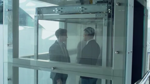 Business Conversation in the Elevator Stock Footage 68644487