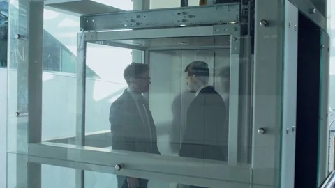Business Conversation in the Elevator Stock Footage 72381617