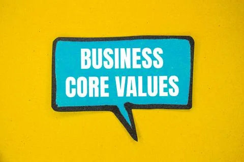 Business core values message written on blue paper speech bubble with yellow  Stock Photos