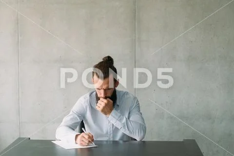 Business correspondence concerned man writing Stock Photos