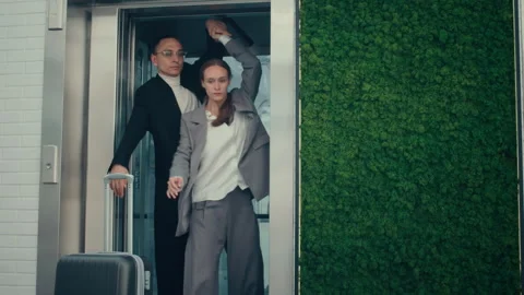 Business Couple Dancing in Elevator Stock Footage 285837068