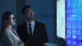 The business couple discussing near the display 4k or 4k+ Resolution