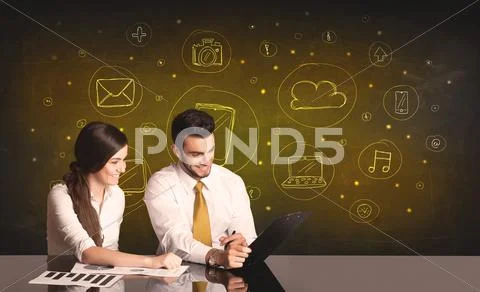 Business couple with media icons background Stock Photos