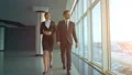 The business couple walking near the window. slow motion HD Footage