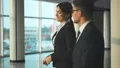 The business couple walking in the office hall. slow motion 4k or 4k+ Resolution