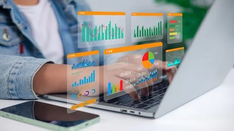 Business Data Analytics and Digital Charts Hologram on Laptop Computer for .. Stock Photos