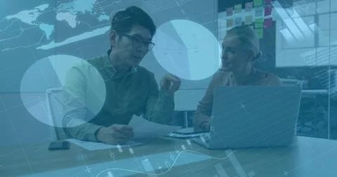 Business data analytics image over colleagues discussing documents in office Foto stock