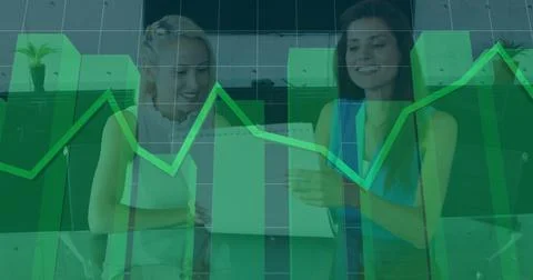 Business data chart image over two women discussing in office Foto stock