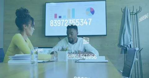 Business data processing image over colleagues discussing documents in office Stock Photos