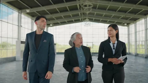 Business Designers Presenting a Workspace Layout Plan to a Corporate Client 動画素材 344939553