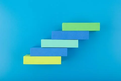 Business development concept. Ladder made of multicolored rectangles with space Stock Photos