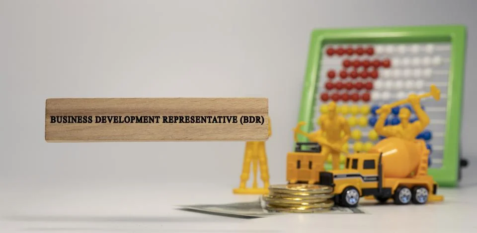 Business development representative ,BDR, was written on a wooden surface. Ec Stock Photos