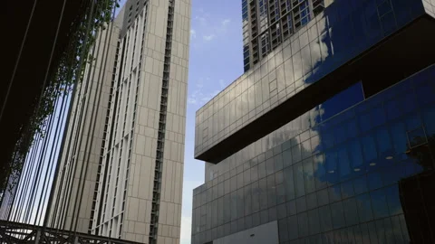 Business District. Angular architecture of modern buildings with glass facades Vídeos de archivo 265055151