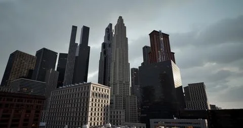 Business district building with wall mirror with cloudy sky Stock Photos