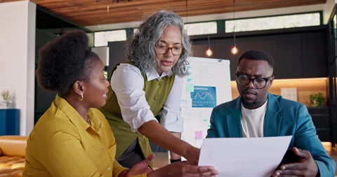 Business, document and team with discussion for real estate, data and plan for Video stock 345302016