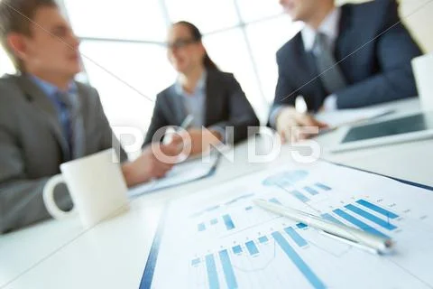 Business document on background of employees planning work at meeting Stock-Fotos