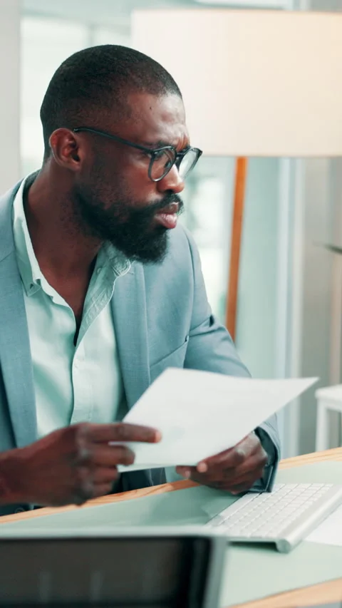 Business, documents and black man on laptop for finance report, investment and Stock Footage 330535796