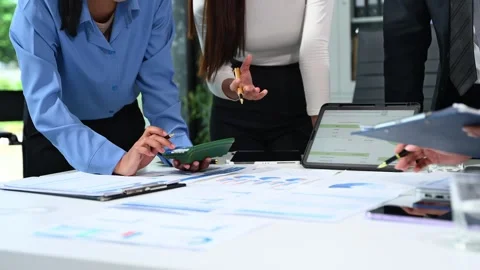 Business documents on office table with smart phone and calculator digital .. Stock Footage 313858025