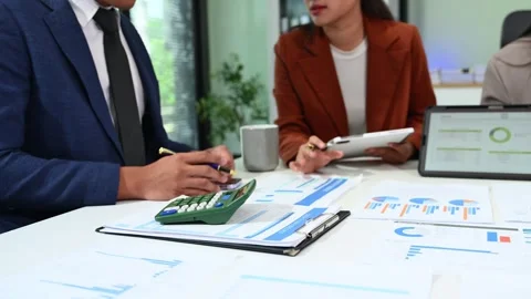 Business documents on office table with smart phone and calculator digital .. Stock Footage 313858066