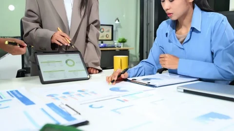 Business documents on office table with smart phone and calculator digital .. Video stock 313858108