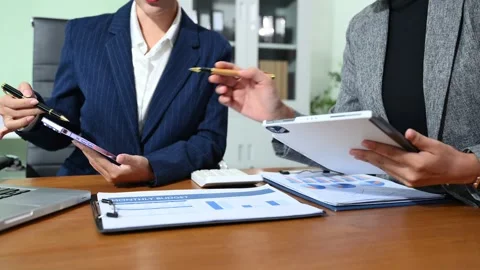 Business documents on office table with smart phone and calculator digital .. Video stock 314351299