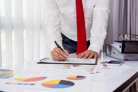 Business documents on office table with smart phone and digital tablet and .. Foto stock