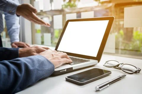 Business documents on office table with smart phone and digital laptop and gr Stock Photos