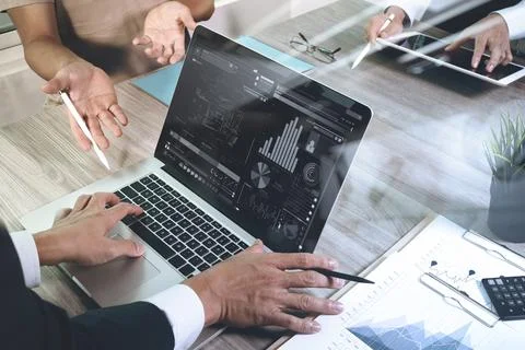 Business documents on office table with smart phone and laptop computer and.. Stock Photos