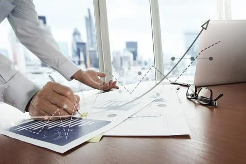 Business documents on office table with smart phone and digital tablet and .. Stock Photos